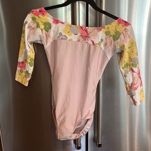 Pale pink with floral sleeve and open back